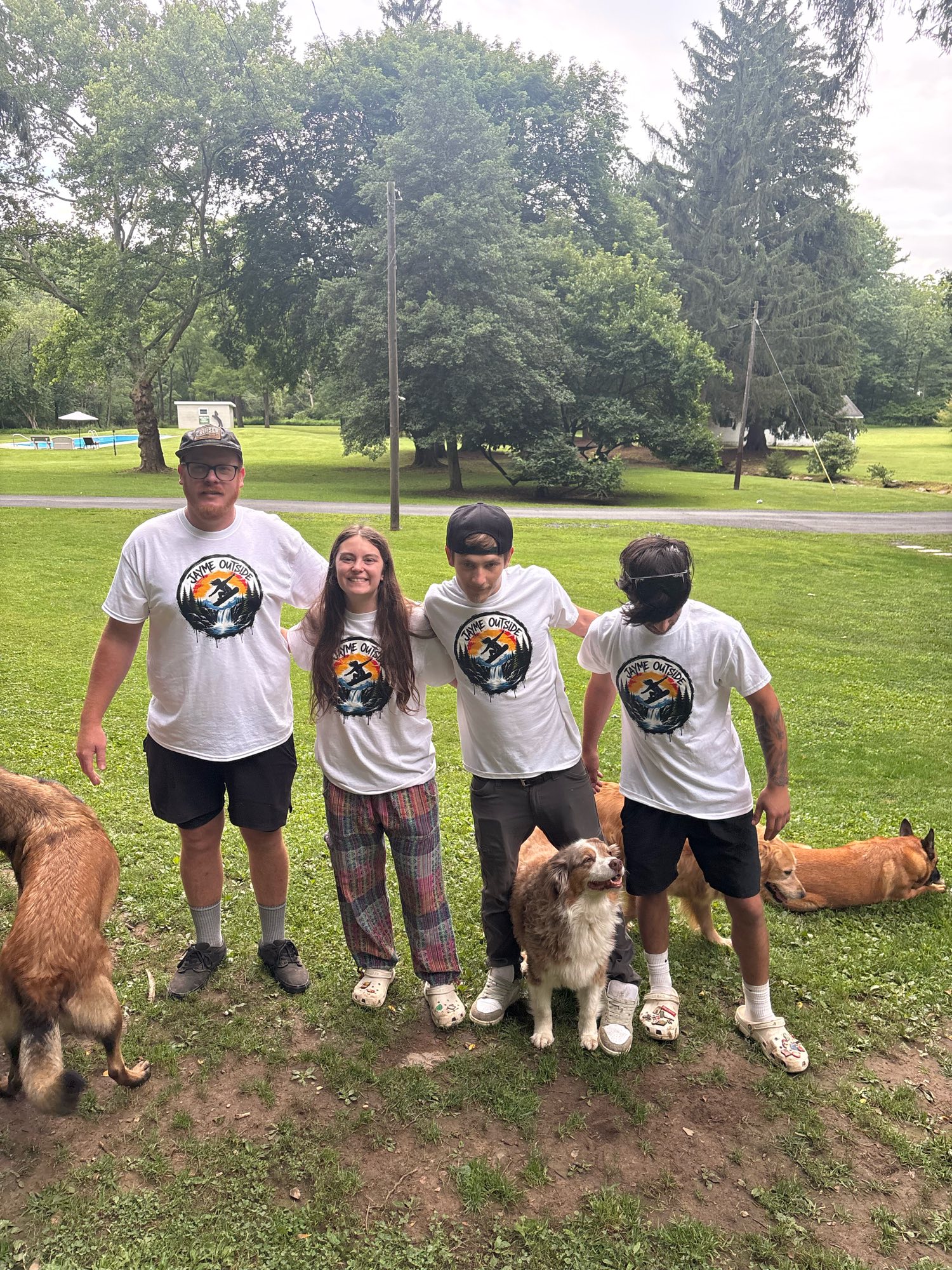 Volunteers in matching shirts with rescue dogs